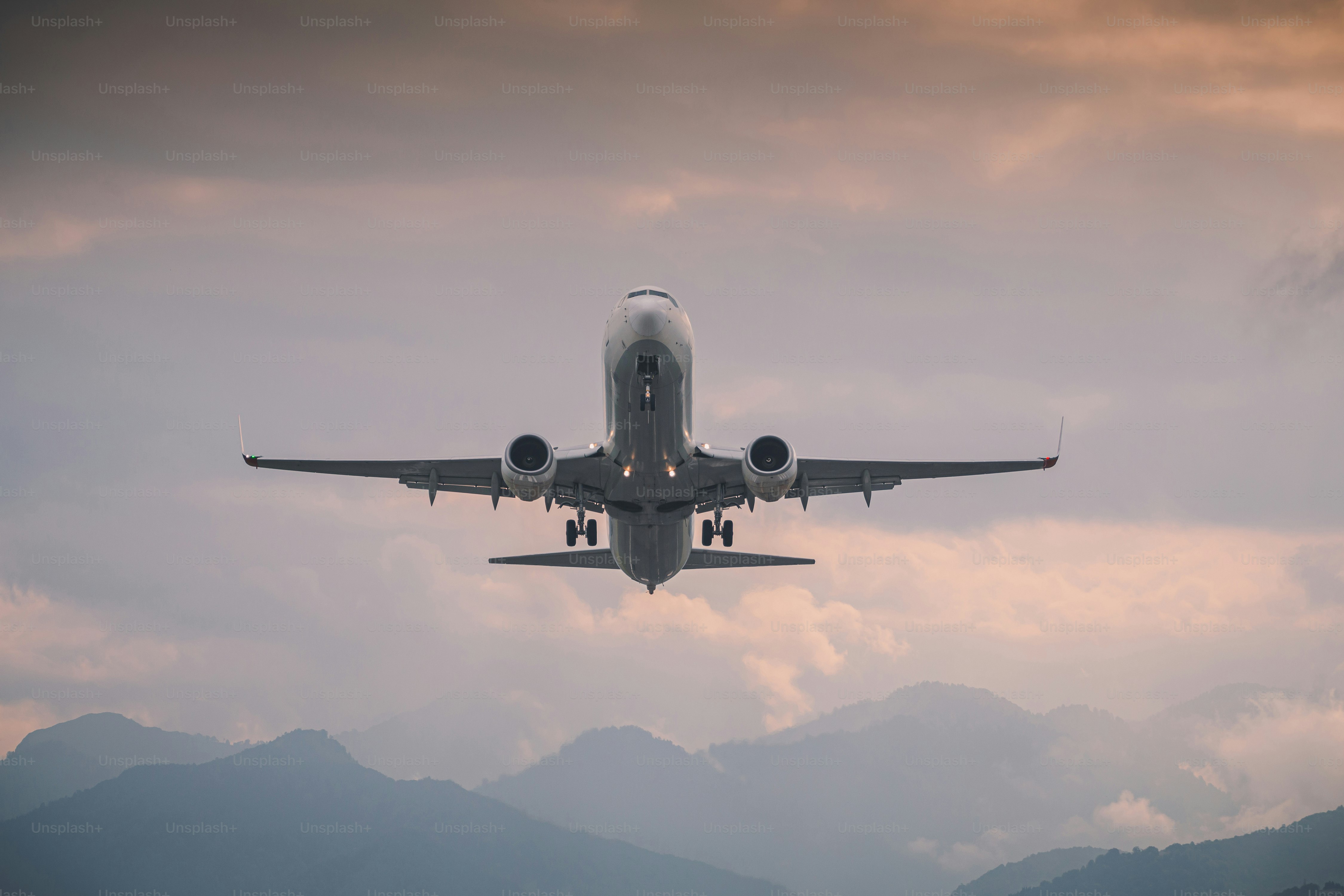 passenger plane takes off front view against